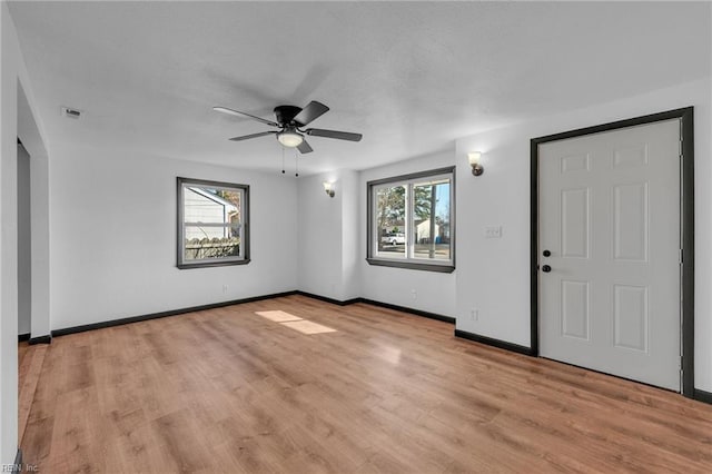 interior space featuring light hardwood / wood-style floors and ceiling fan