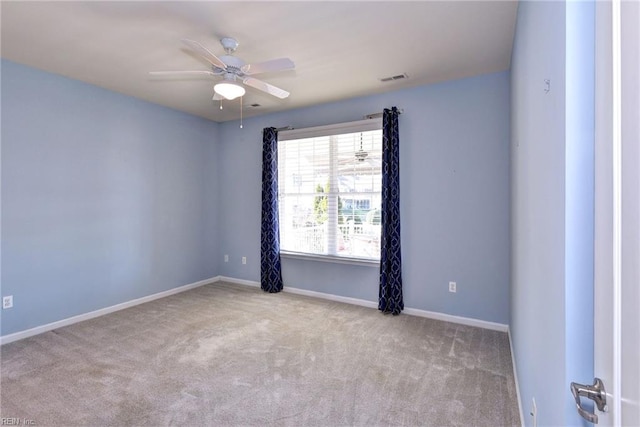 empty room with light carpet and ceiling fan