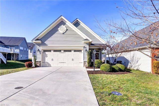 view of front of property featuring a garage and a front yard