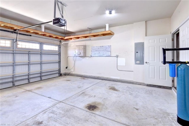 garage featuring a garage door opener and electric panel