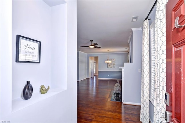 hallway featuring crown molding and dark wood-type flooring