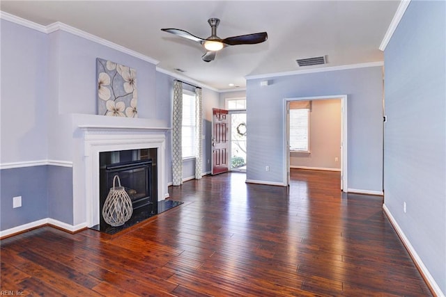 unfurnished living room featuring crown molding, dark hardwood / wood-style floors, and ceiling fan