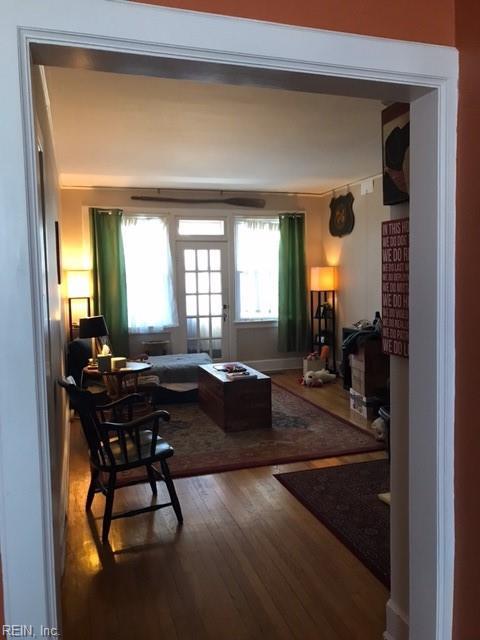 living area with hardwood / wood-style floors