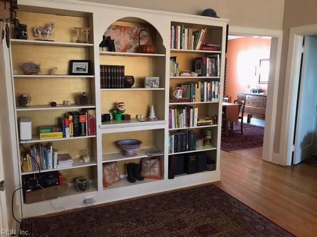 living area with hardwood / wood-style flooring