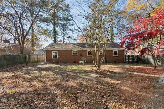 back of property featuring central AC