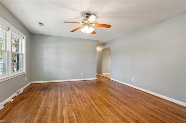 empty room featuring light hardwood / wood-style flooring and ceiling fan