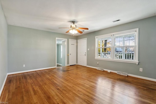 unfurnished room featuring wood-type flooring and ceiling fan