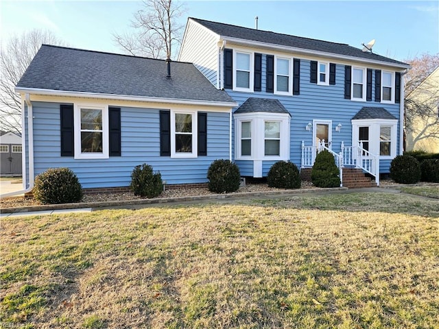 colonial inspired home with a front yard