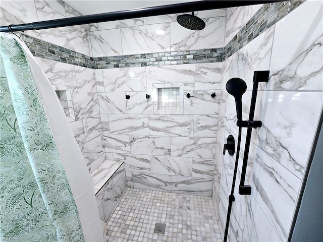 bathroom with a tile shower