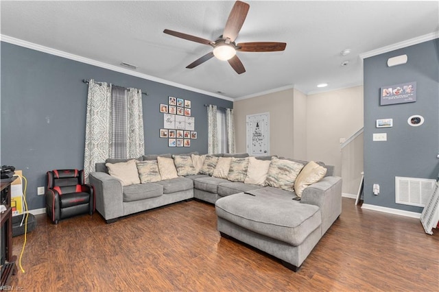 living room featuring ceiling fan, ornamental molding, and dark hardwood / wood-style flooring