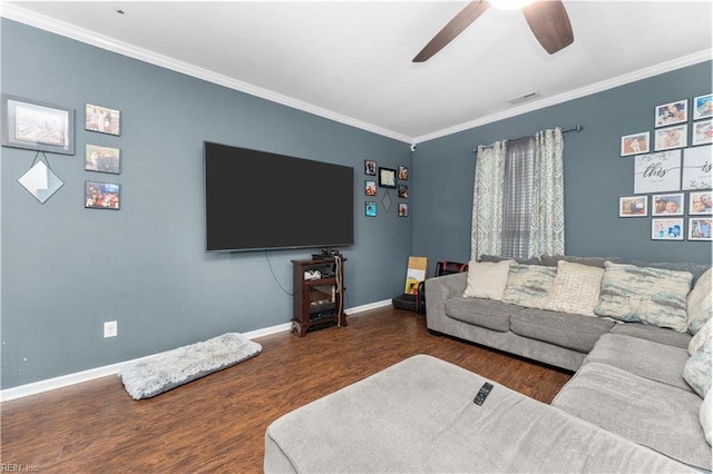 living room featuring ornamental molding, dark wood-type flooring, and ceiling fan