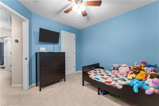 bedroom with light carpet and ceiling fan