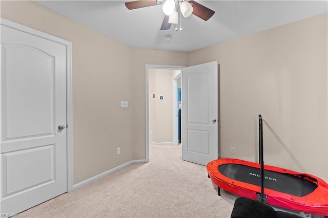 rec room with light colored carpet and ceiling fan