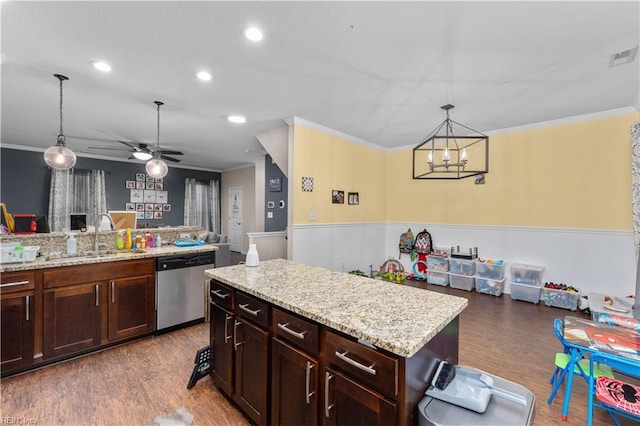 kitchen featuring dark wood-type flooring, sink, a center island, hanging light fixtures, and dishwasher