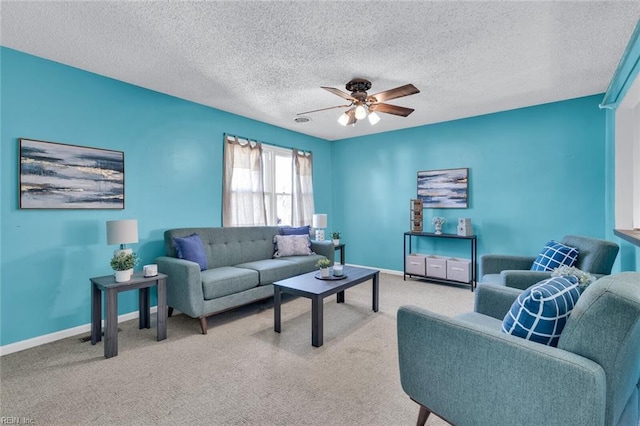 living room with a textured ceiling, ceiling fan, and carpet flooring