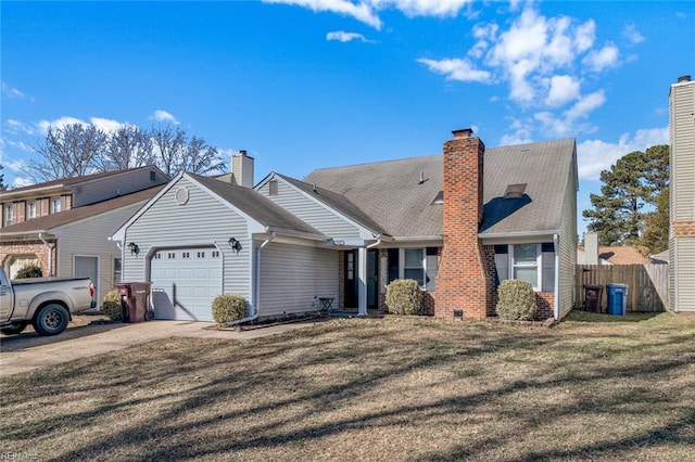 view of front of home with a garage and a front yard