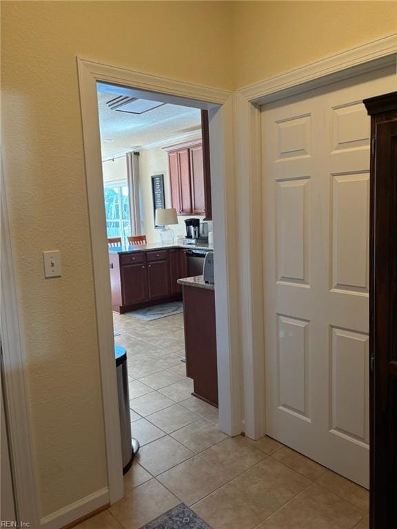 hallway with light tile patterned flooring