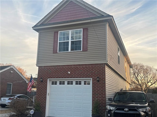 property exterior at dusk featuring a garage