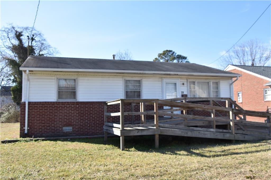 back of house with a yard and a deck