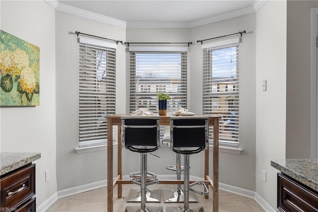 dining area featuring ornamental molding