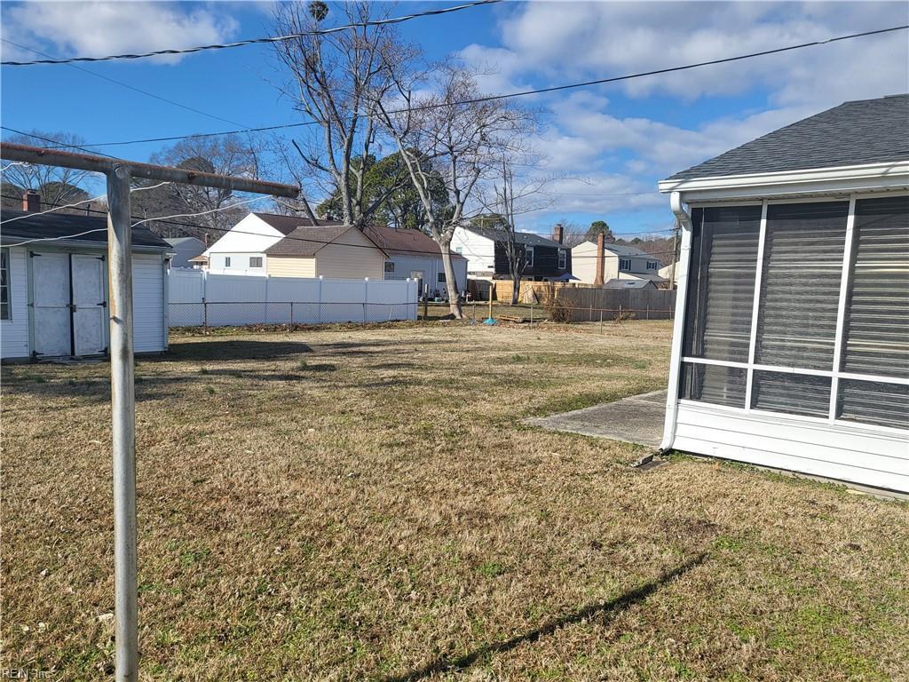 view of yard with a sunroom