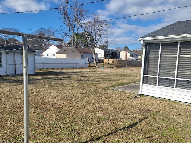 view of yard with a sunroom