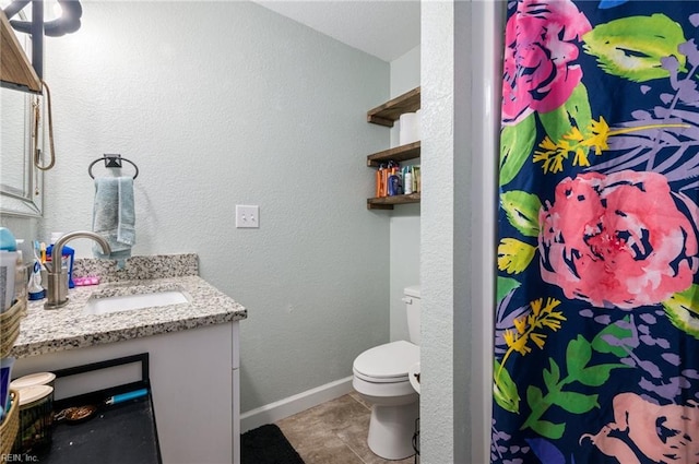 bathroom with vanity, tile patterned flooring, toilet, and a shower with shower curtain