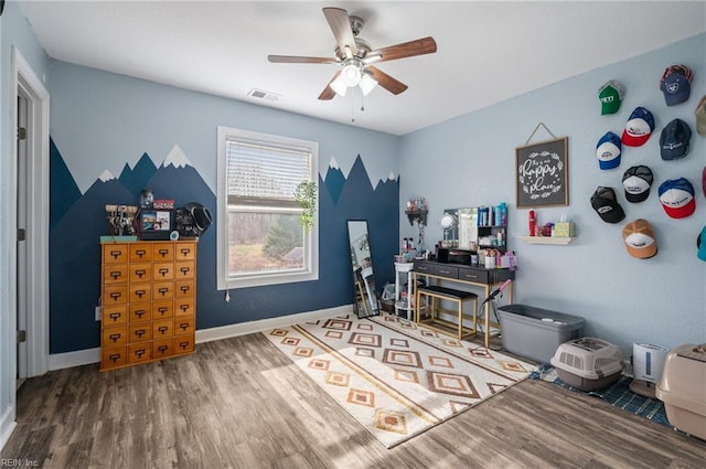 misc room featuring hardwood / wood-style flooring and ceiling fan