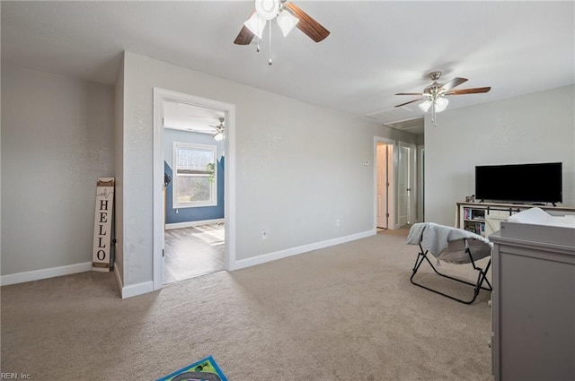 unfurnished living room featuring light colored carpet and ceiling fan