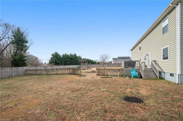 view of yard with a playground and a deck