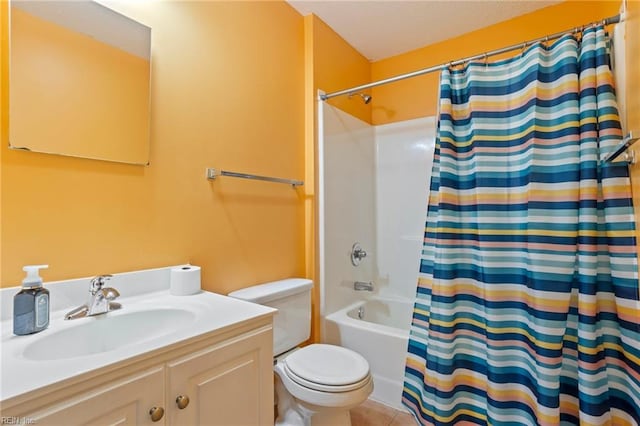 full bathroom featuring shower / tub combo with curtain, vanity, toilet, and tile patterned floors