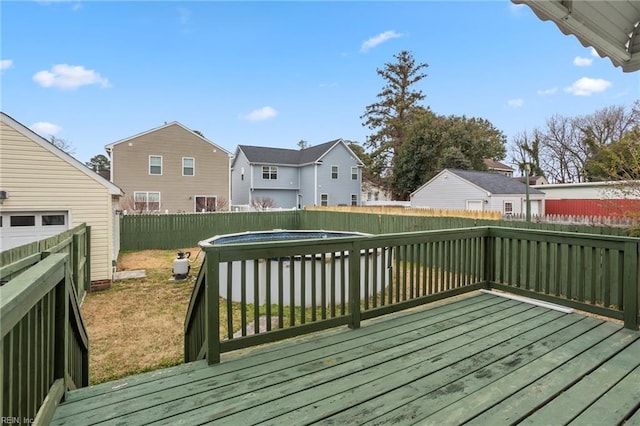 wooden terrace featuring a fenced in pool and a yard