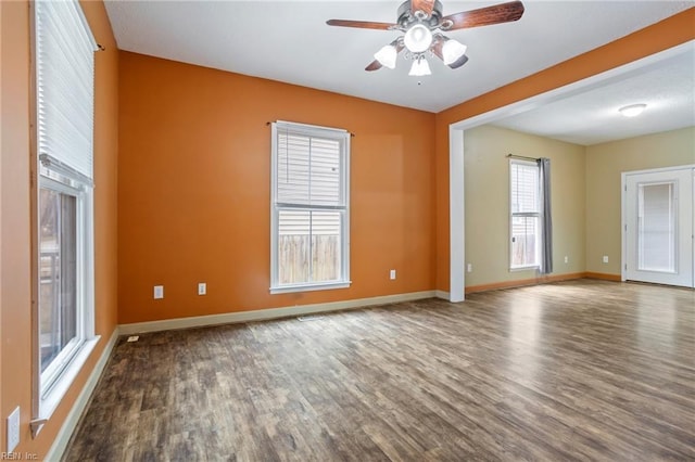 spare room featuring hardwood / wood-style flooring and ceiling fan