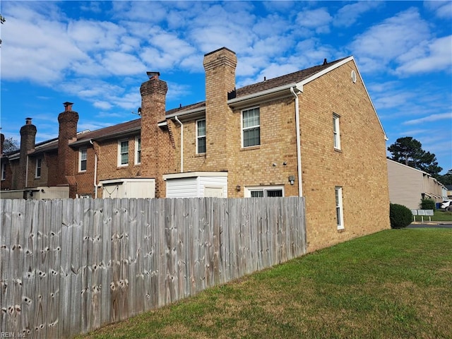 back of house with a yard