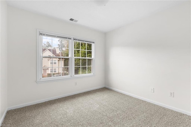 unfurnished room with carpet flooring