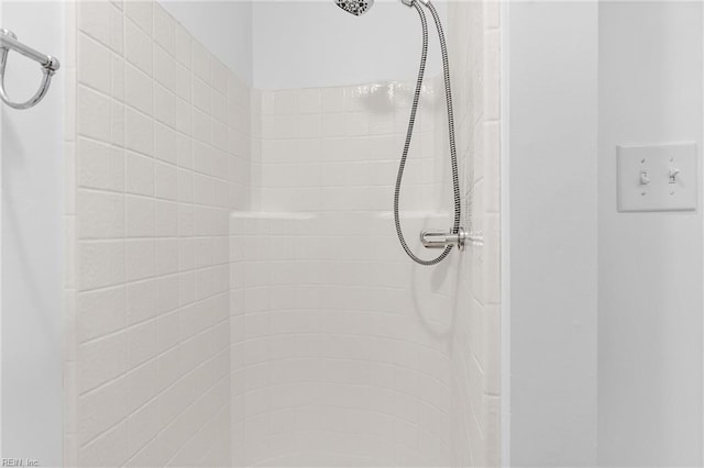 bathroom with a tile shower