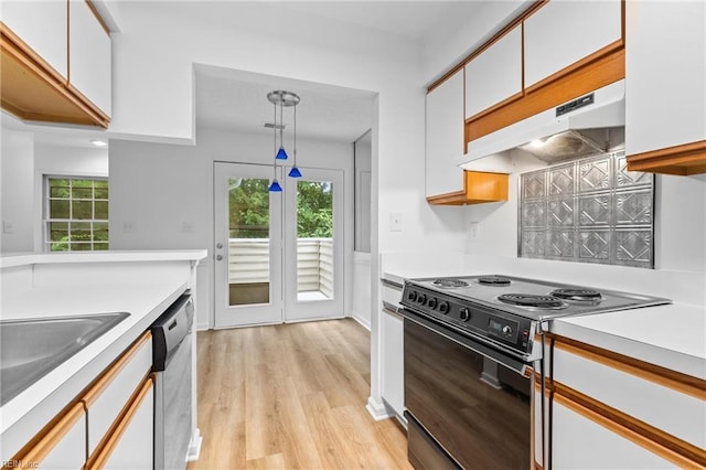 kitchen featuring pendant lighting, white cabinetry, black electric range oven, stainless steel dishwasher, and light wood-type flooring