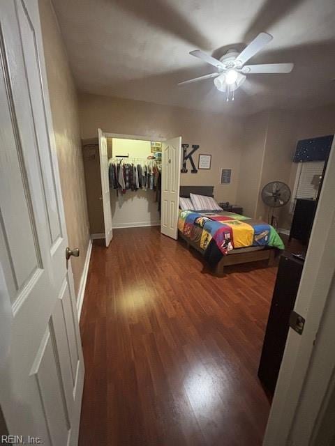 bedroom featuring dark wood-type flooring and ceiling fan