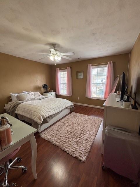 bedroom featuring dark wood-type flooring and ceiling fan