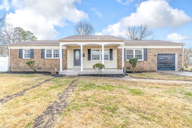 ranch-style home with a garage, covered porch, and a front lawn