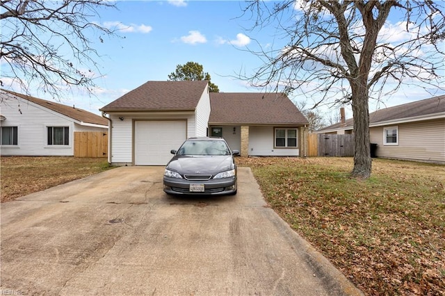 single story home featuring a garage and a front lawn