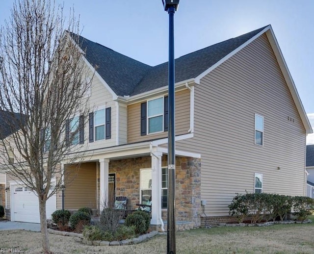 view of front of house featuring a garage and covered porch