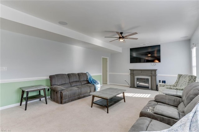 living room with light carpet and ceiling fan