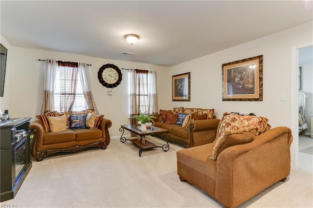 carpeted living room featuring a wealth of natural light