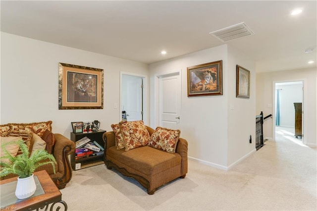 living area with light colored carpet