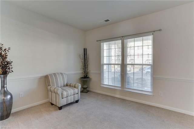 living area featuring light colored carpet