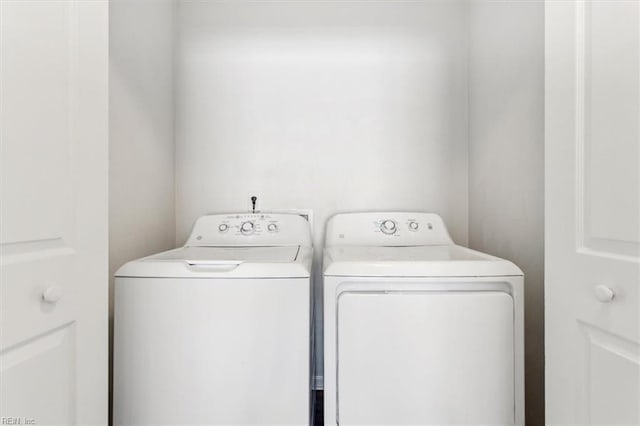 laundry room featuring separate washer and dryer