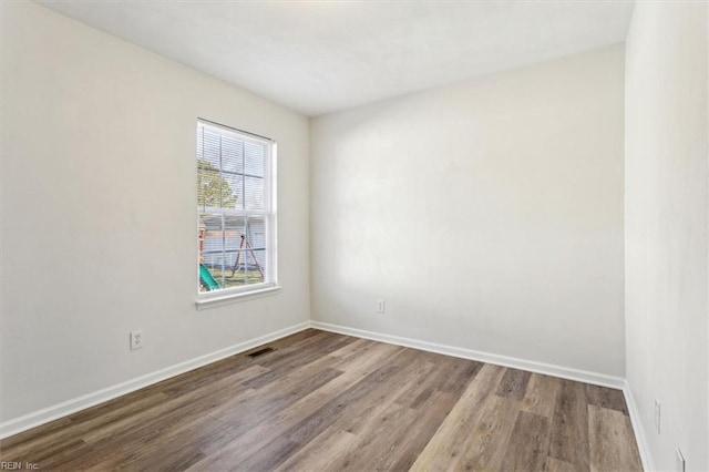 spare room featuring hardwood / wood-style floors