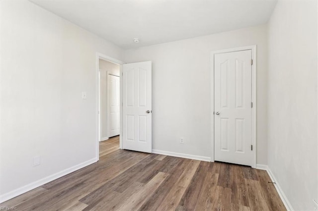 unfurnished bedroom featuring hardwood / wood-style floors