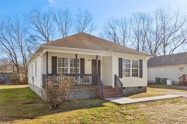 bungalow-style house with a front yard and covered porch